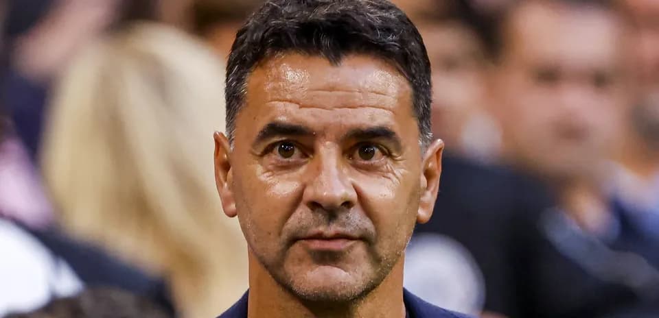 Coach observing during a match in the stands