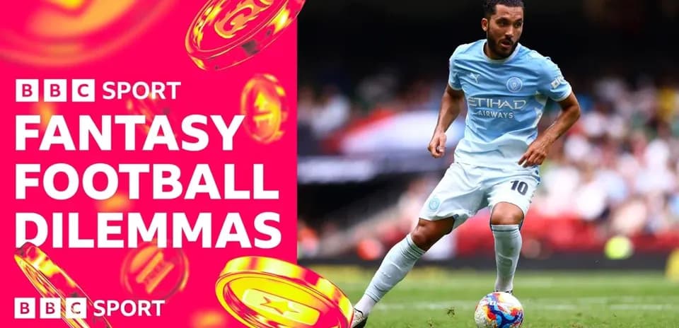 Player in light blue kit dribbling on the field