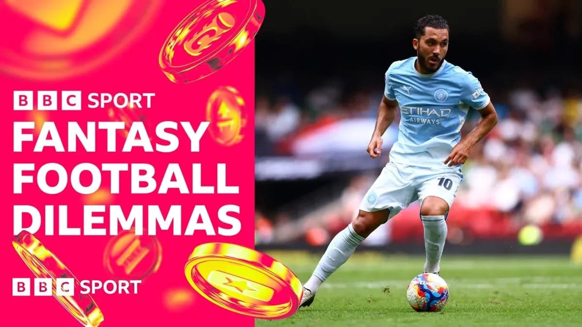 Player in light blue kit dribbling on the field