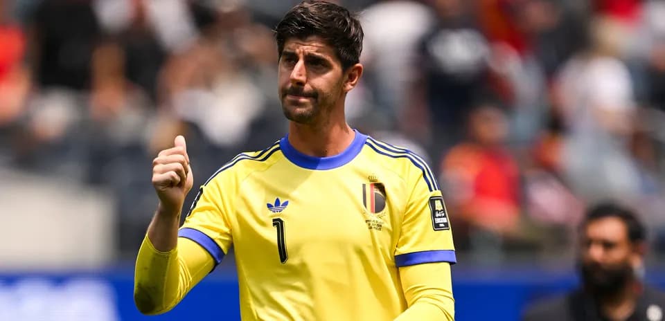 Goalkeeper gesturing during a match in yellow kit