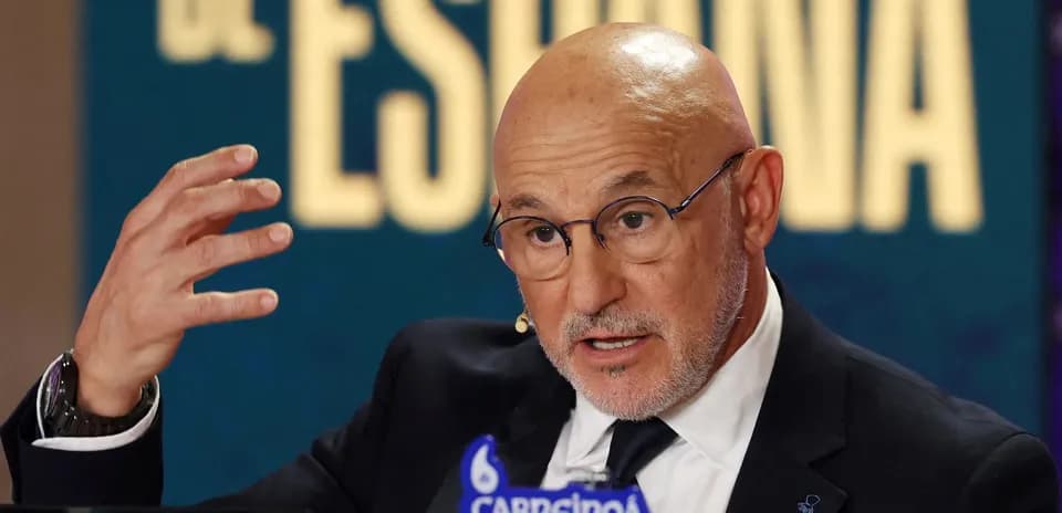 Speaker gesturing during press conference with logos