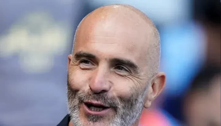 Smiling man with a beard during event