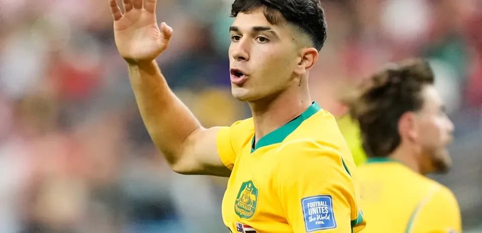 Player gesturing during match in yellow jersey