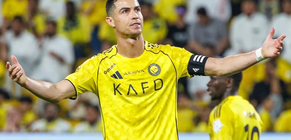 Player gesturing during match in yellow jersey
