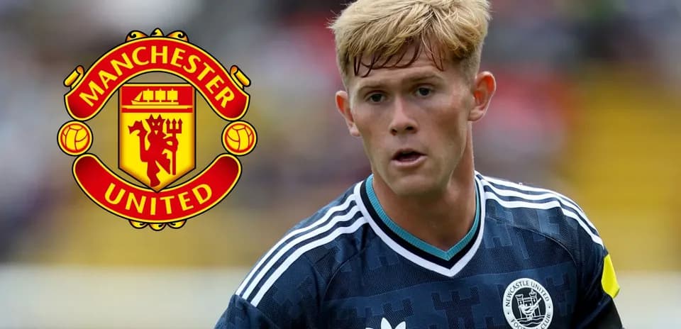 Player in kit during match with Manchester United logo