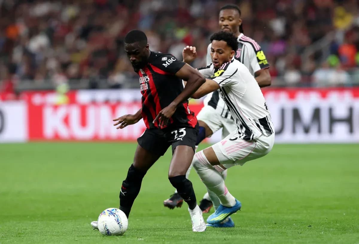 Players battling for possession during Serie A match