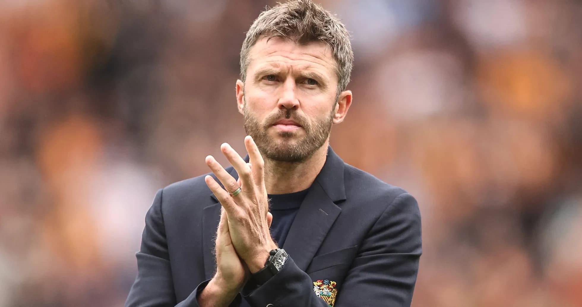 Coach clapping during match at stadium