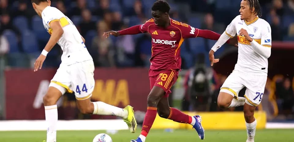 Player 78 dribbling past two defenders during match
