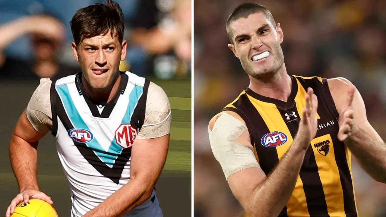 Two AFL players preparing for play on field