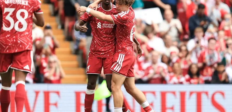 Liverpool players celebrating on the pitch