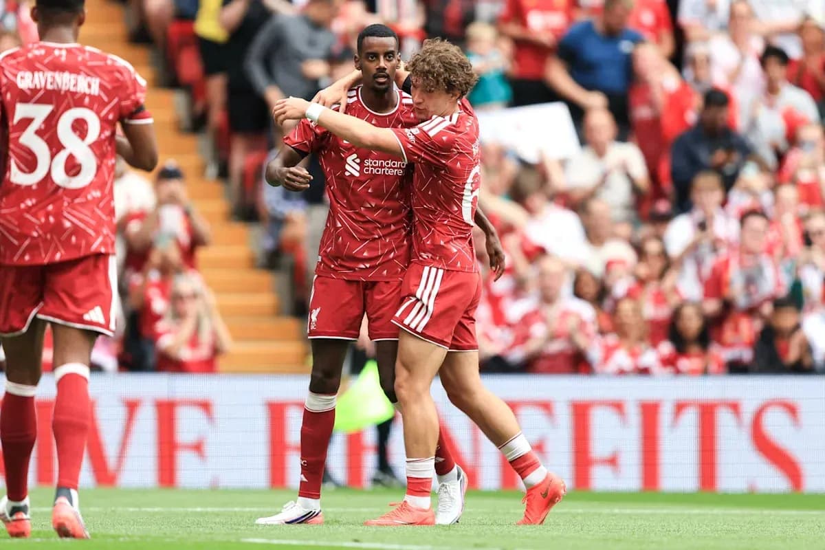 Liverpool players celebrating on the pitch