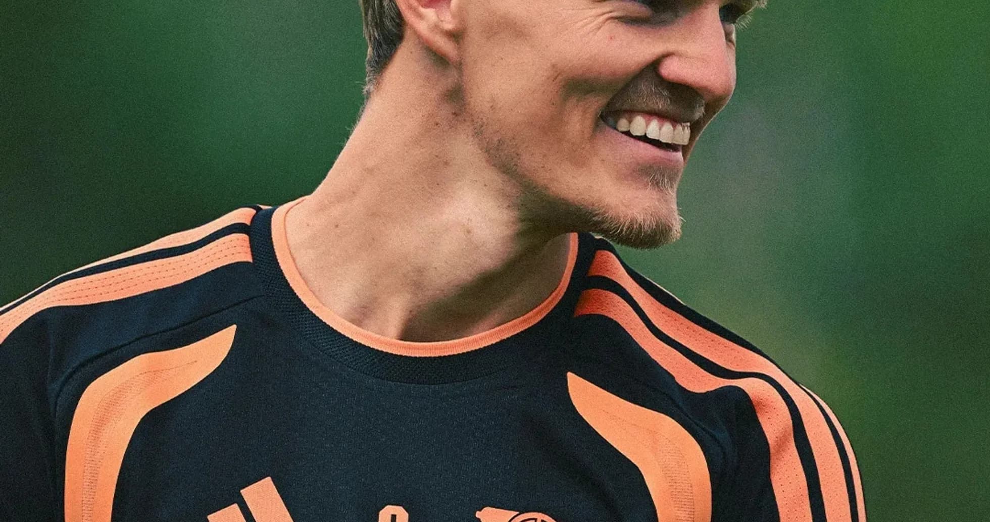 Player smiling in training kit during session