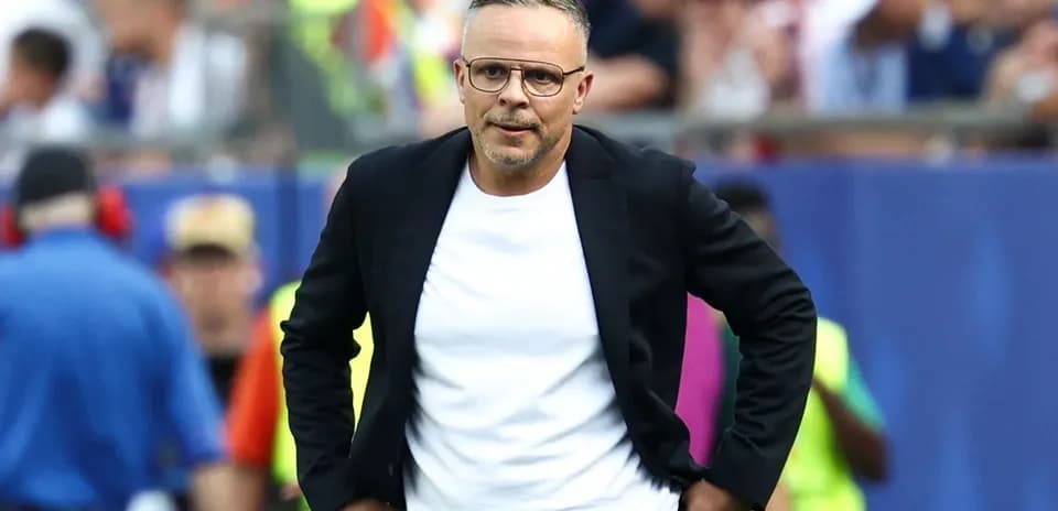 Coach walking on the sideline during match