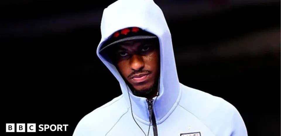 Player wearing hoodie before match preparation