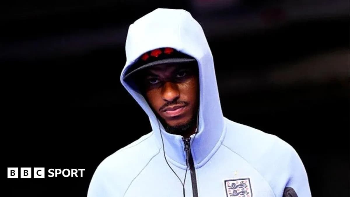 Player wearing hoodie before match preparation