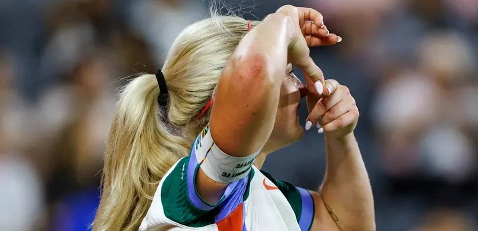 Athlete adjusting headband during sporting event