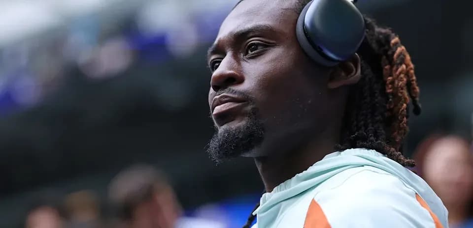 Player wearing headphones before the match