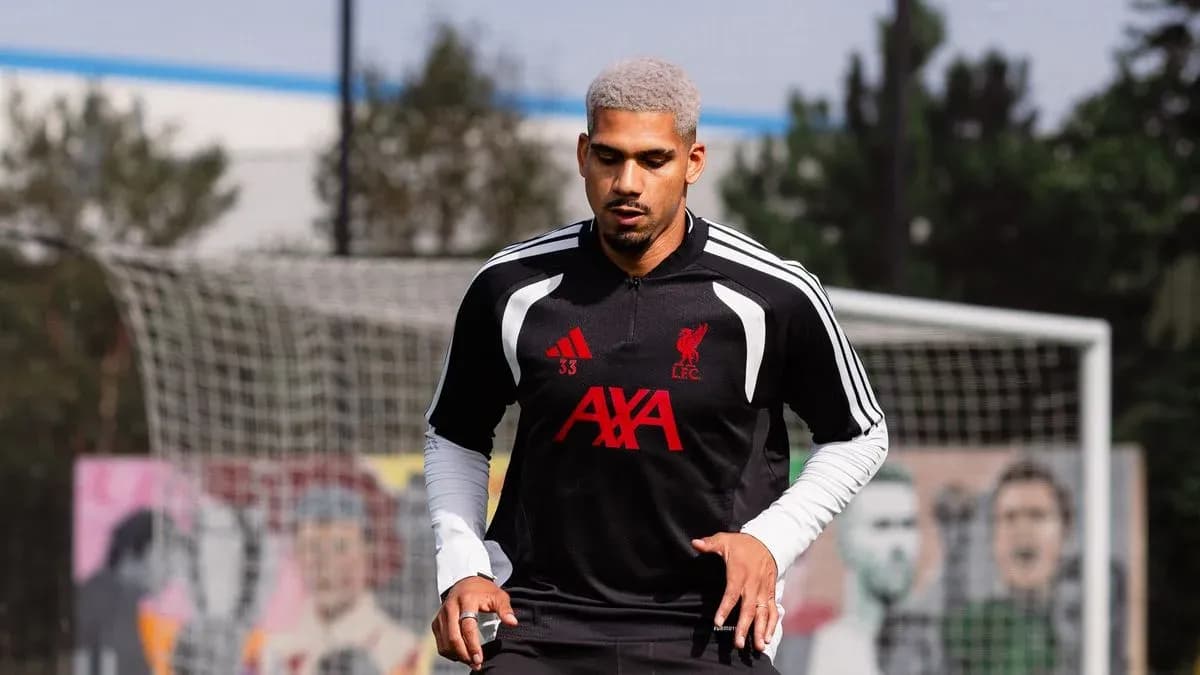 Player training in Liverpool FC kit on pitch