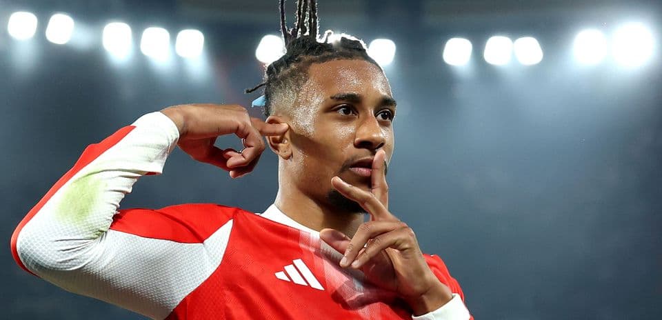 Player celebrating a goal with finger to lips
