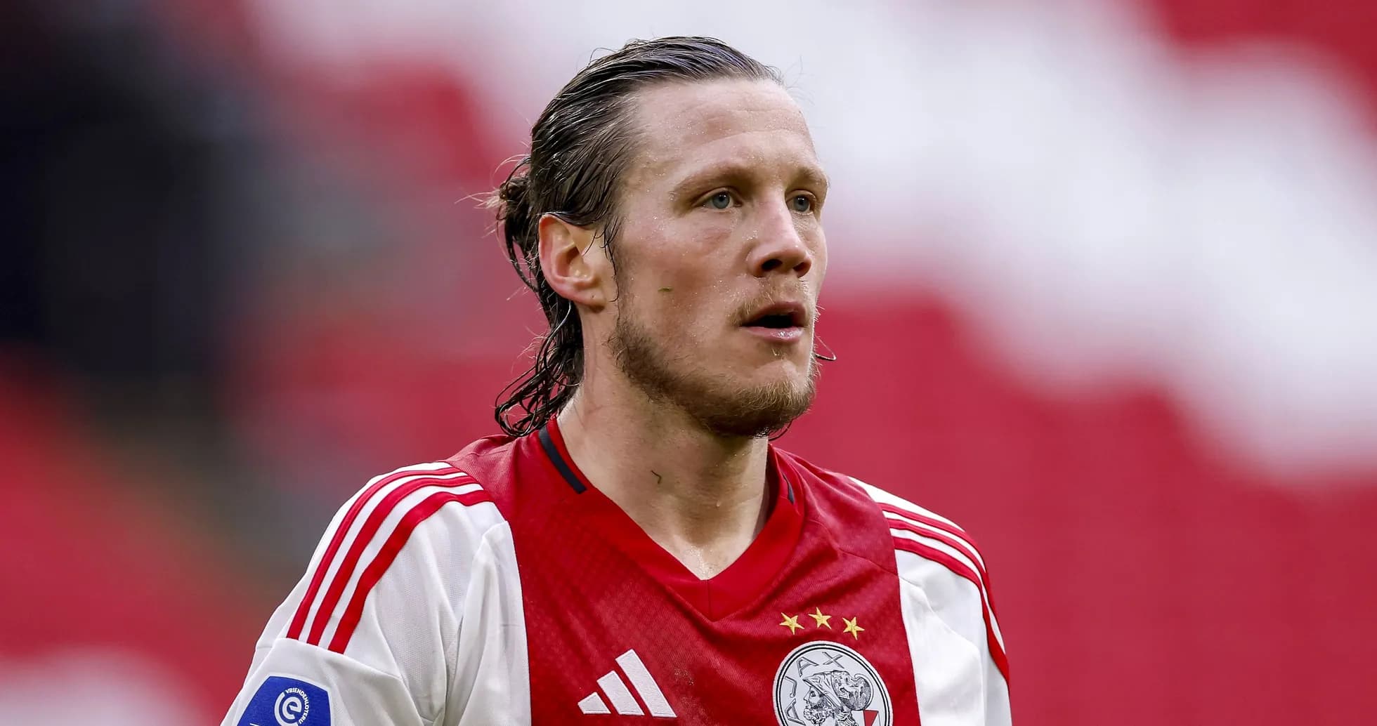 Player wearing Ajax jersey on the field