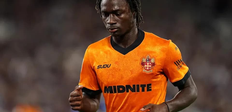 Player in orange jersey during a match
