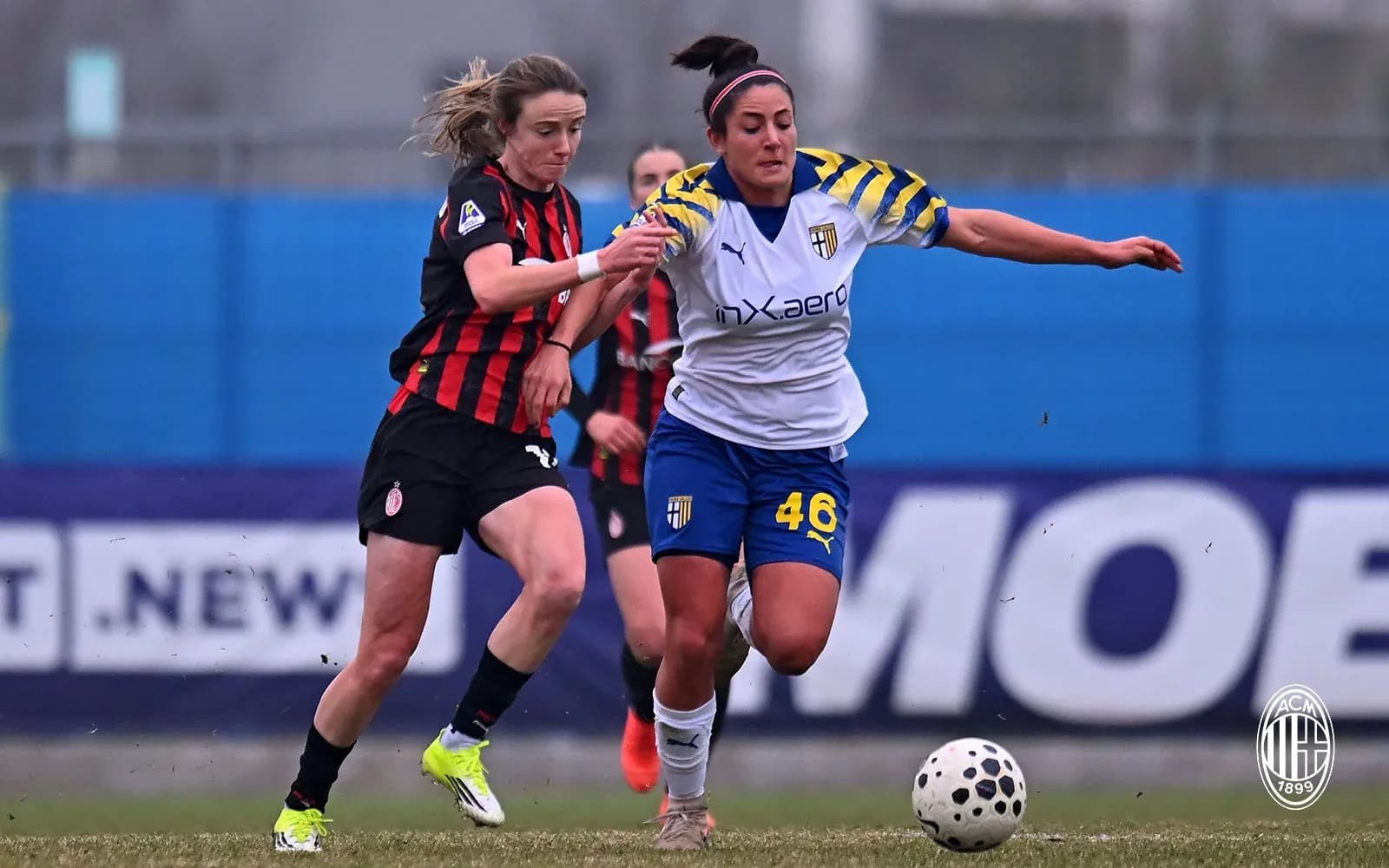 AC Milan W player tackling Parma W player