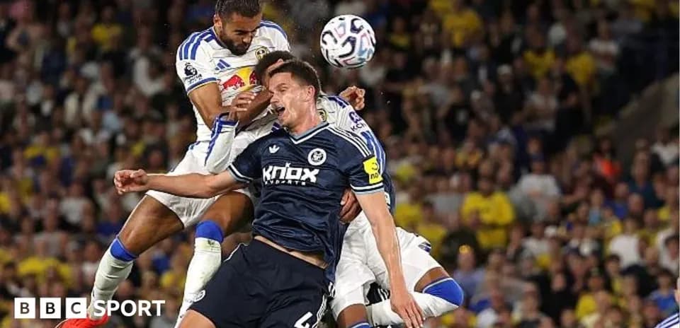 Players contesting a high ball during match action