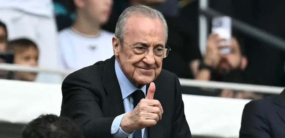 Man giving thumbs up in stadium stands