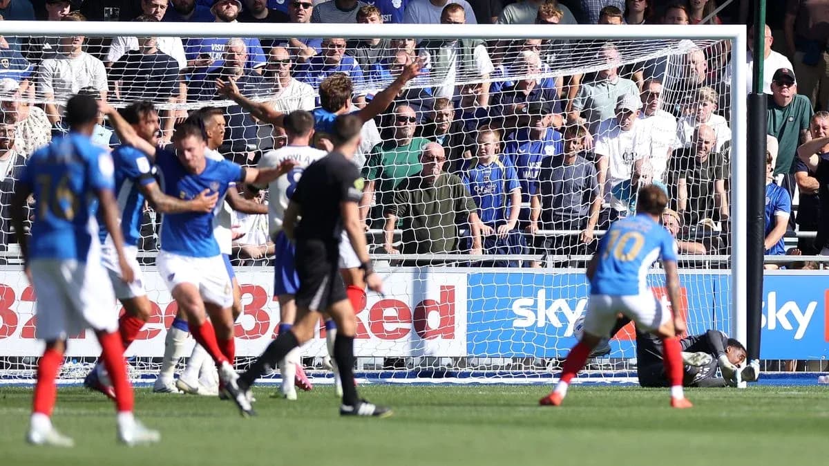 Players reacting during a goal attempt in match