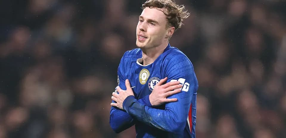 Player celebrating in Chelsea jersey during match