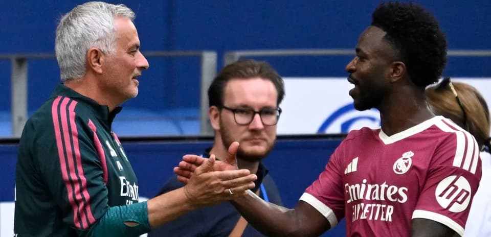 Manager and player shaking hands during warm-up