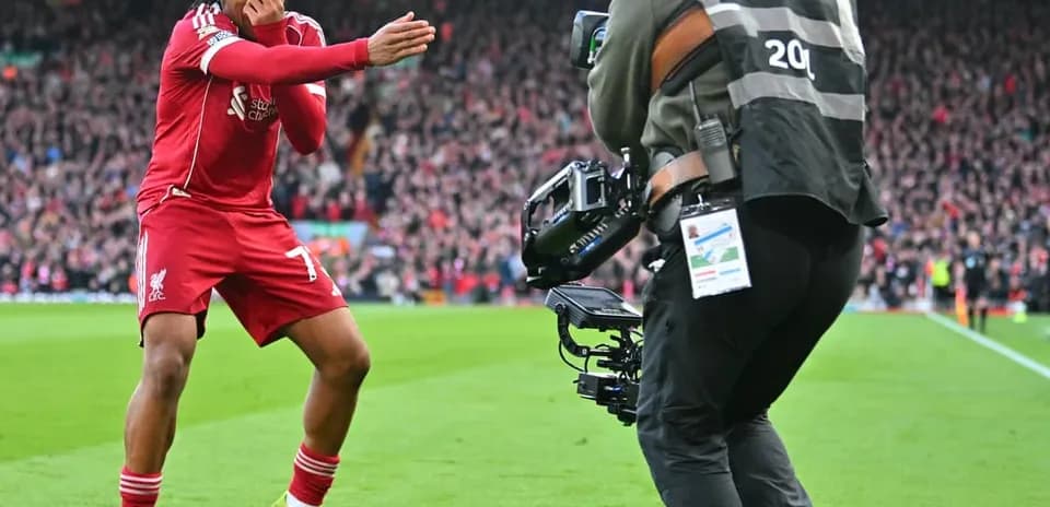 Liverpool player celebrating after scoring goal