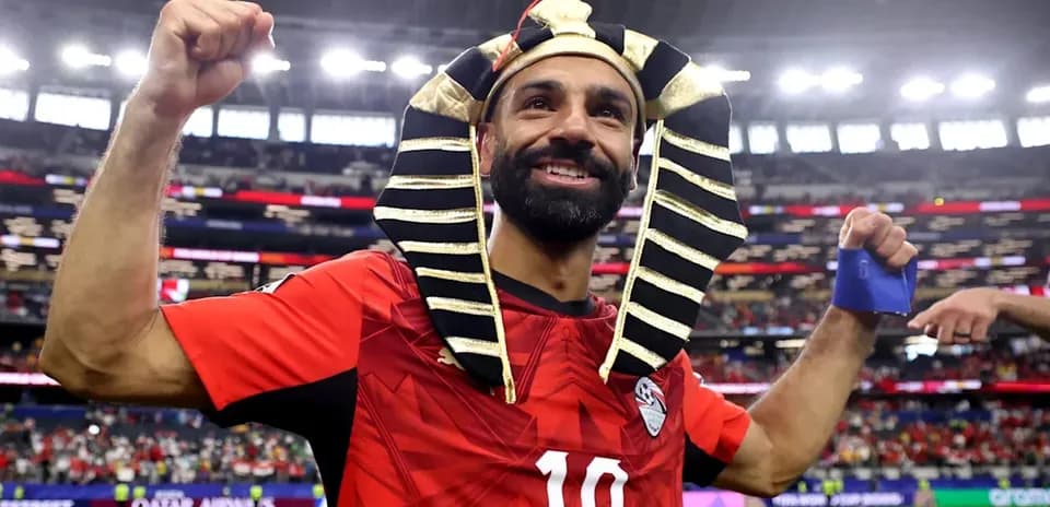 Player celebrating in Egyptian pharaoh headdress after match