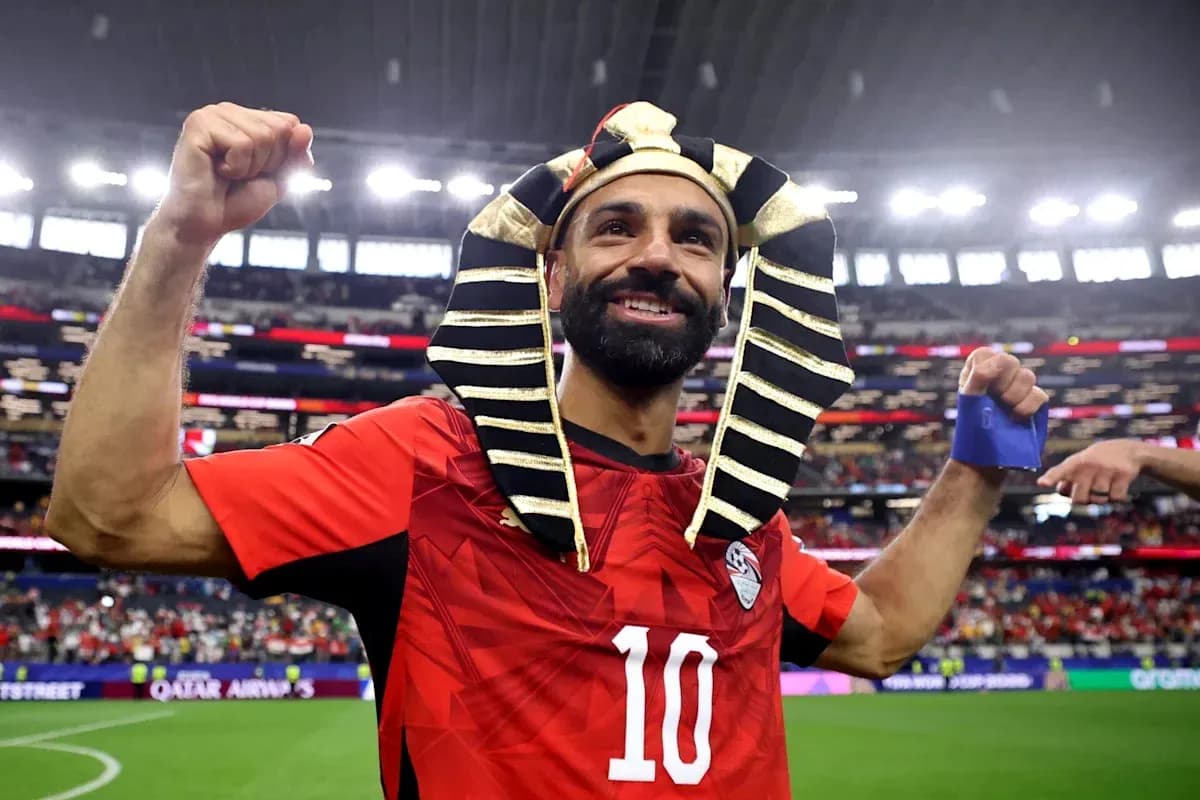 Player celebrating in Egyptian pharaoh headdress after match