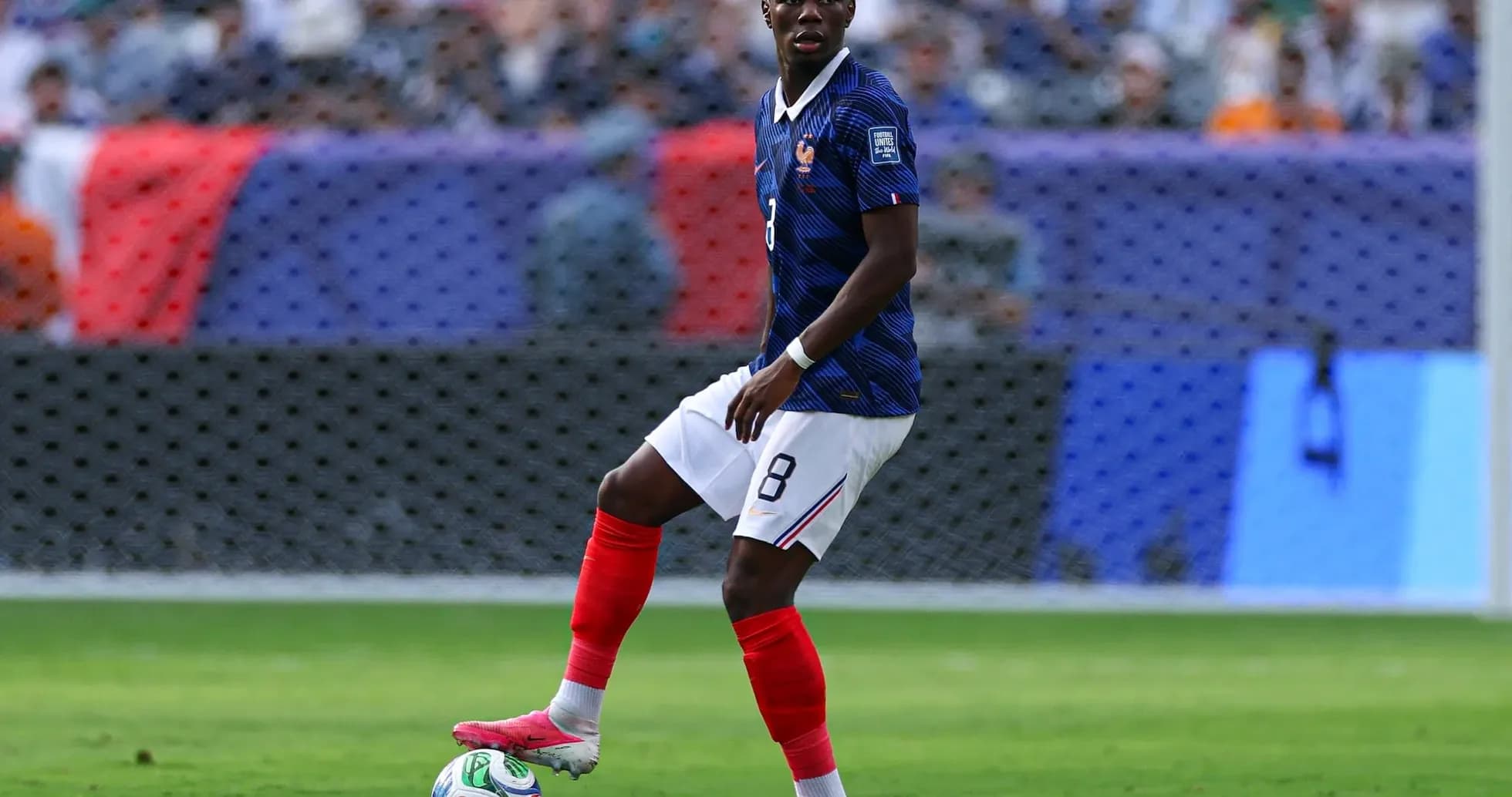 France player dribbling the ball during match