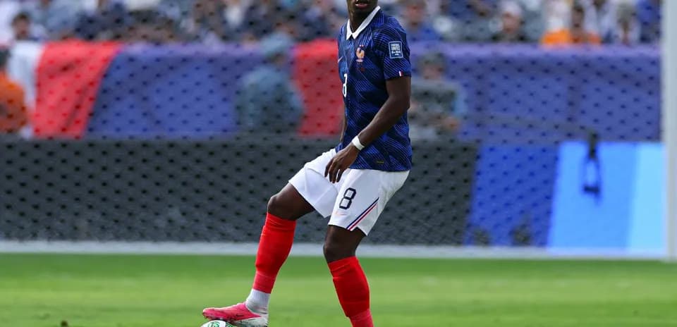 France player dribbling the ball during match