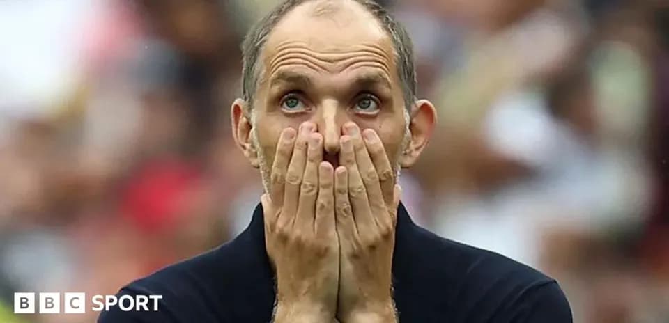 Coach reacting during a tense moment in match