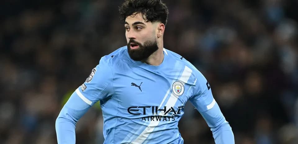 Player in light blue Manchester City kit during match