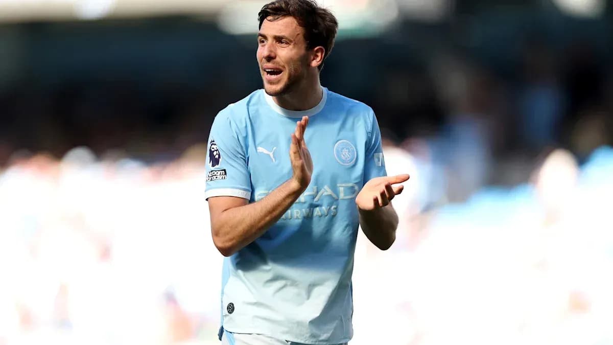 Player applauding fans during a match