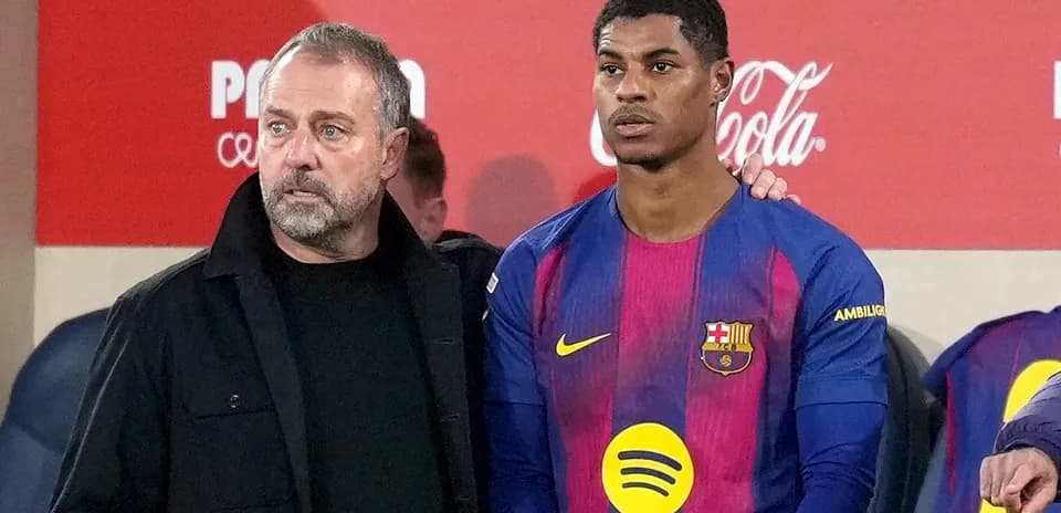 Coach and player on the sidelines during match