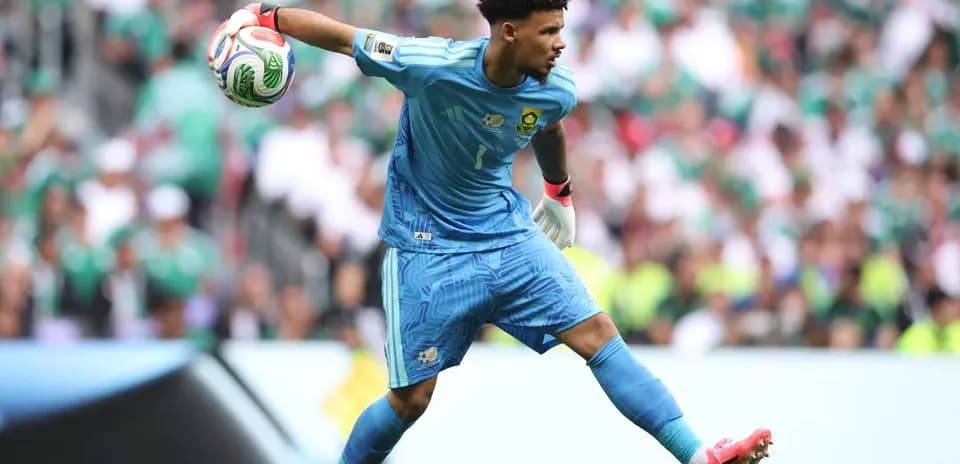 Goalkeeper throwing ball during match