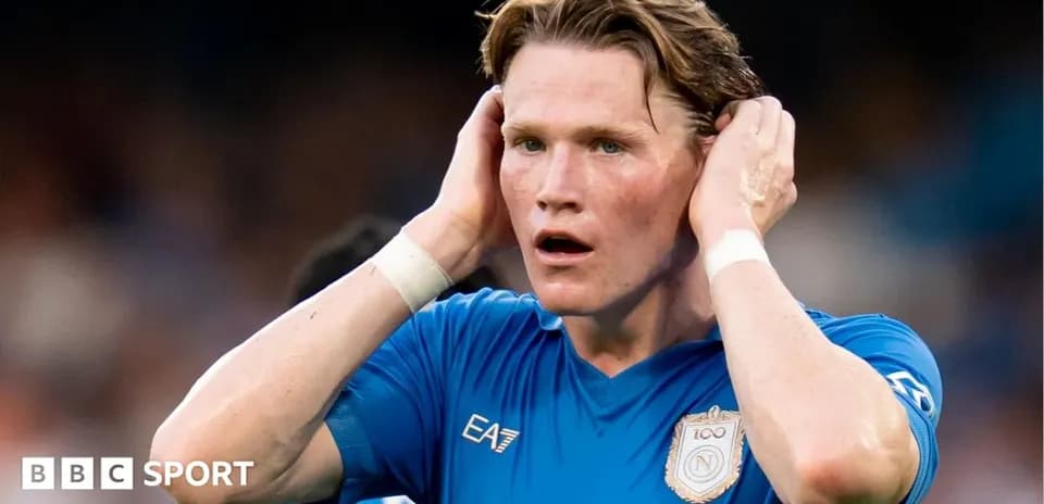 Player in blue shirt holding head during match