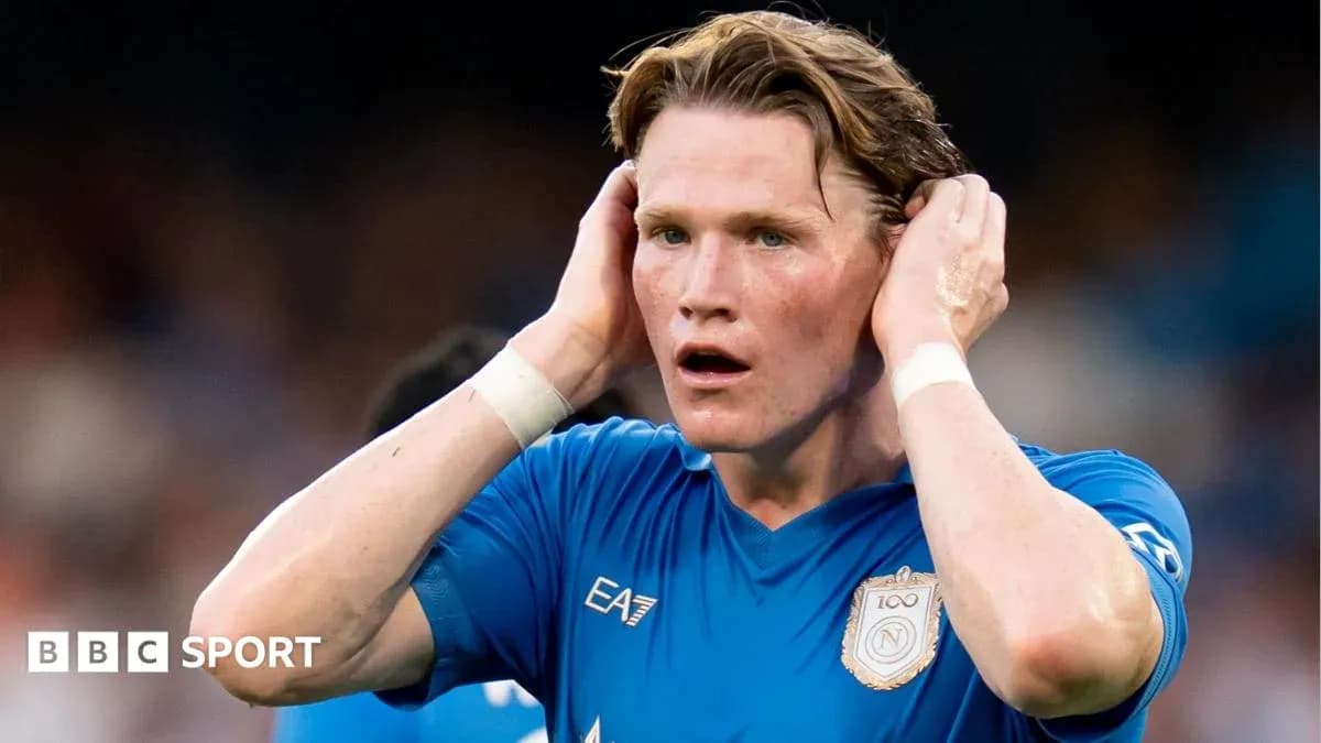 Player in blue shirt holding head during match