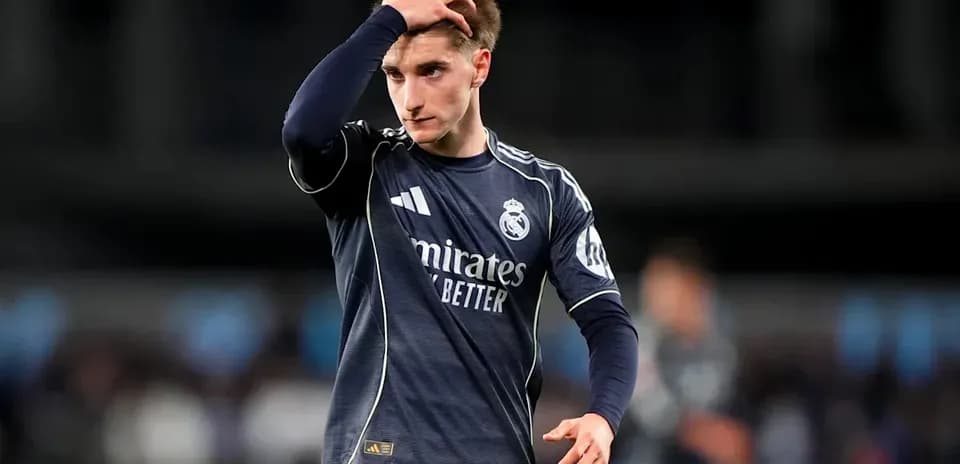 Player in Real Madrid kit walking on field