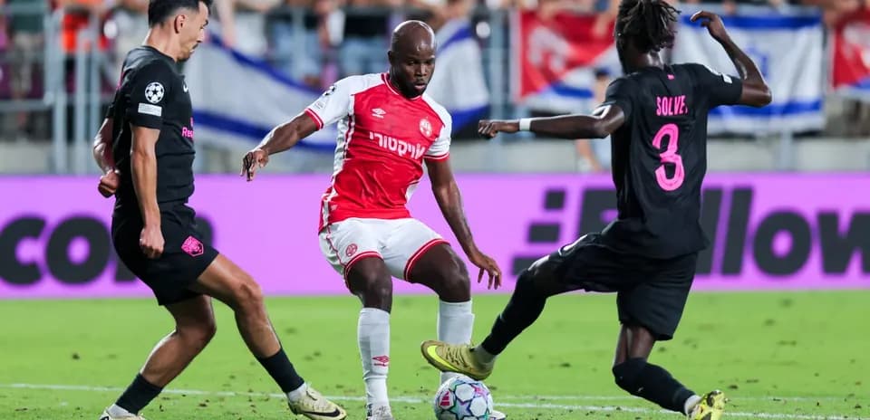 Two players contesting the ball during match