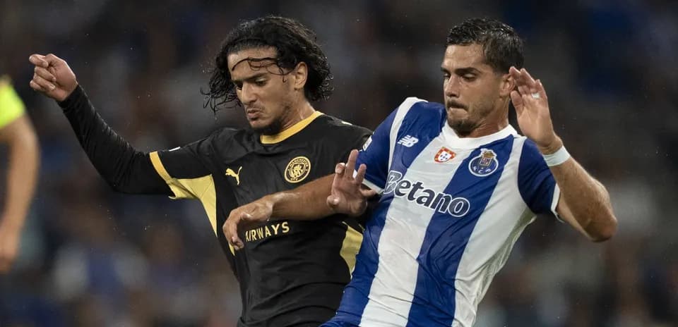 Two players challenging for the ball during match