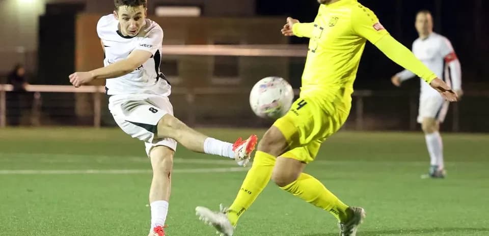 Player kicking ball during SC St. Tönis match