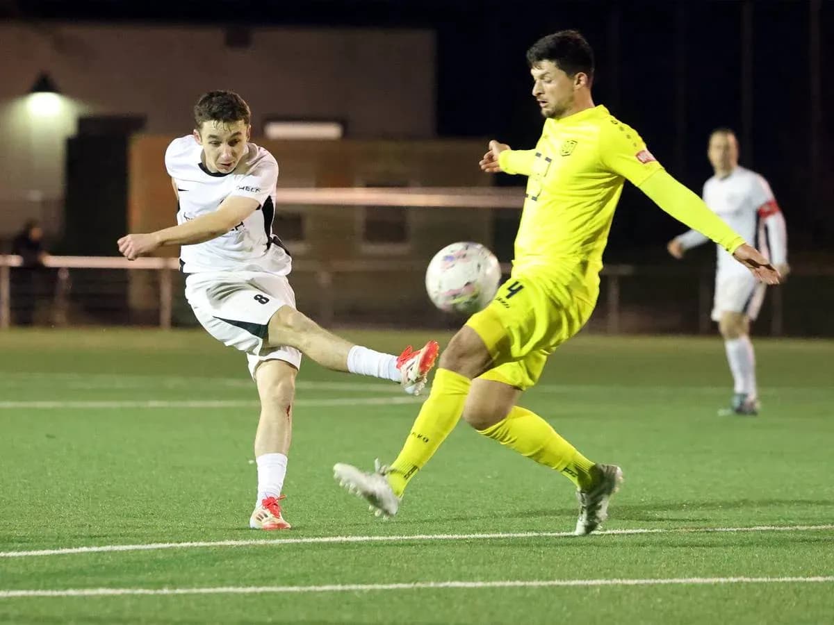 Player kicking ball during SC St. Tönis match