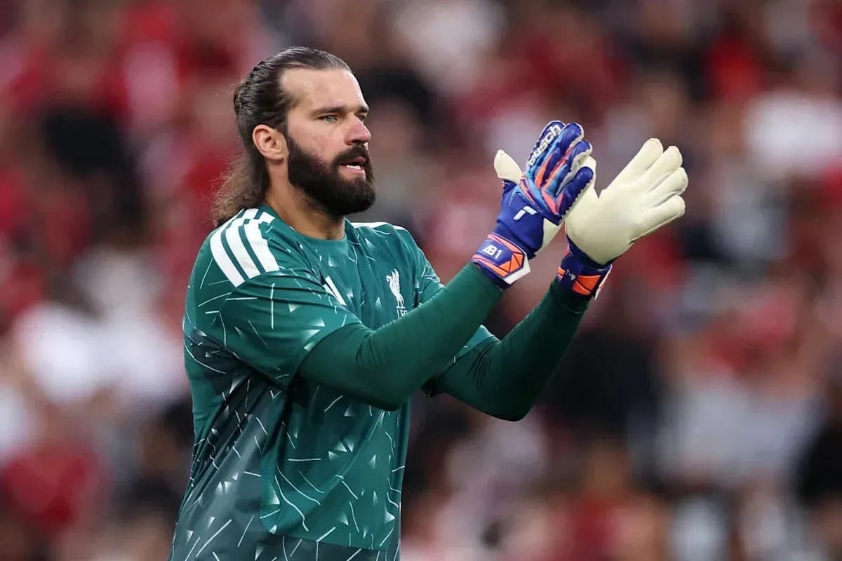 Goalkeeper in green kit gesturing during match