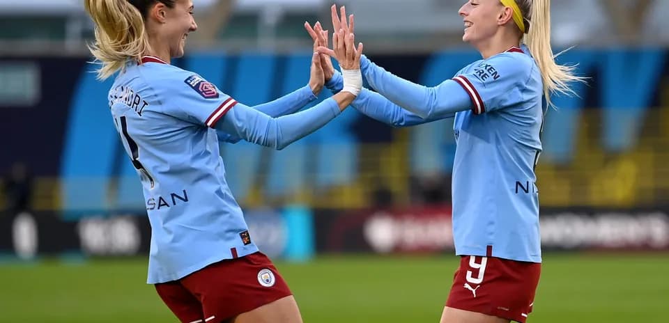 Manchester City players celebrating a goal